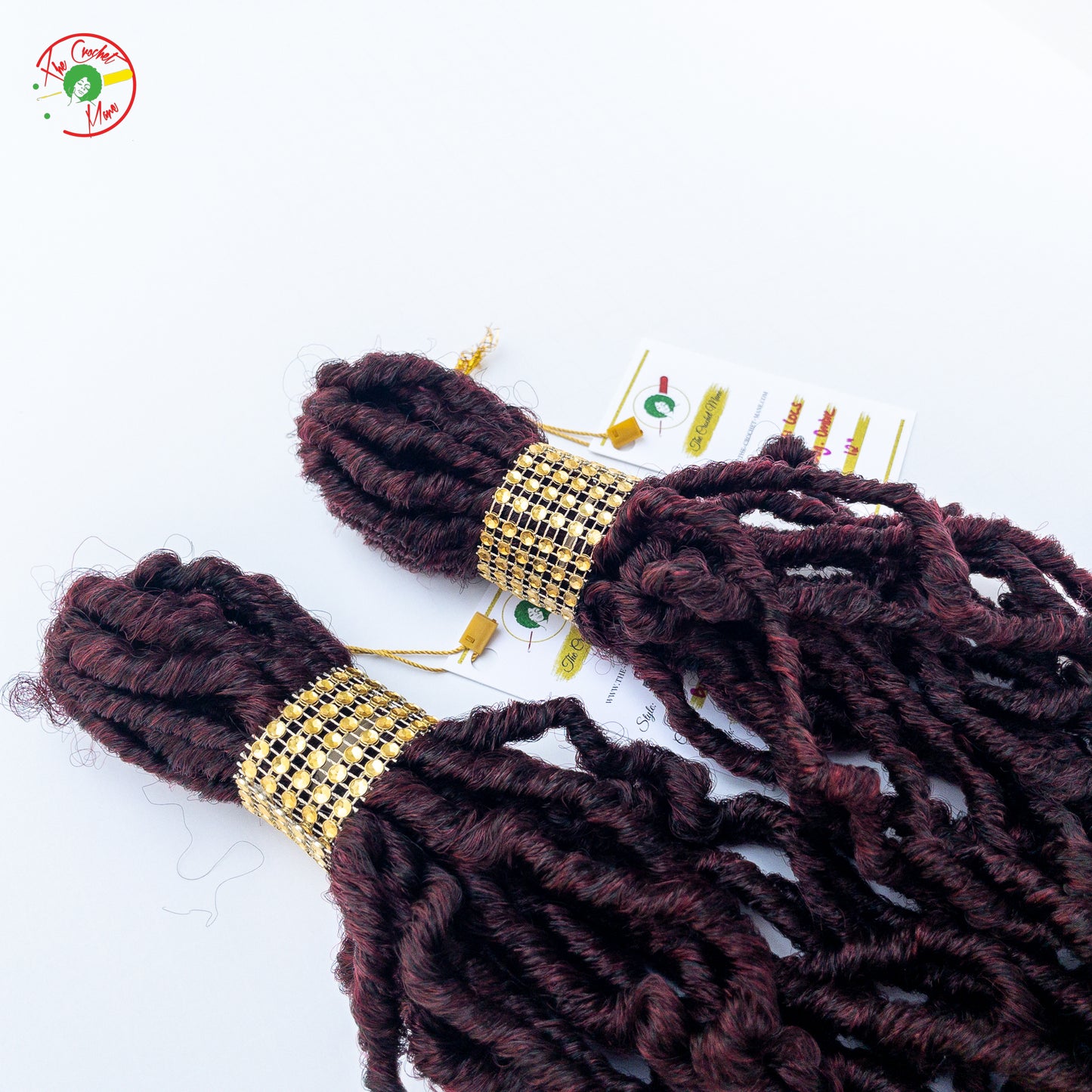 Two Crochet Locs Bundle Laying Flat Beside Each Other Against A White Background